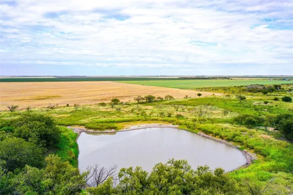 an aerial view of beach and city space