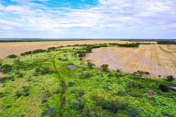 a view of a lake with a yard