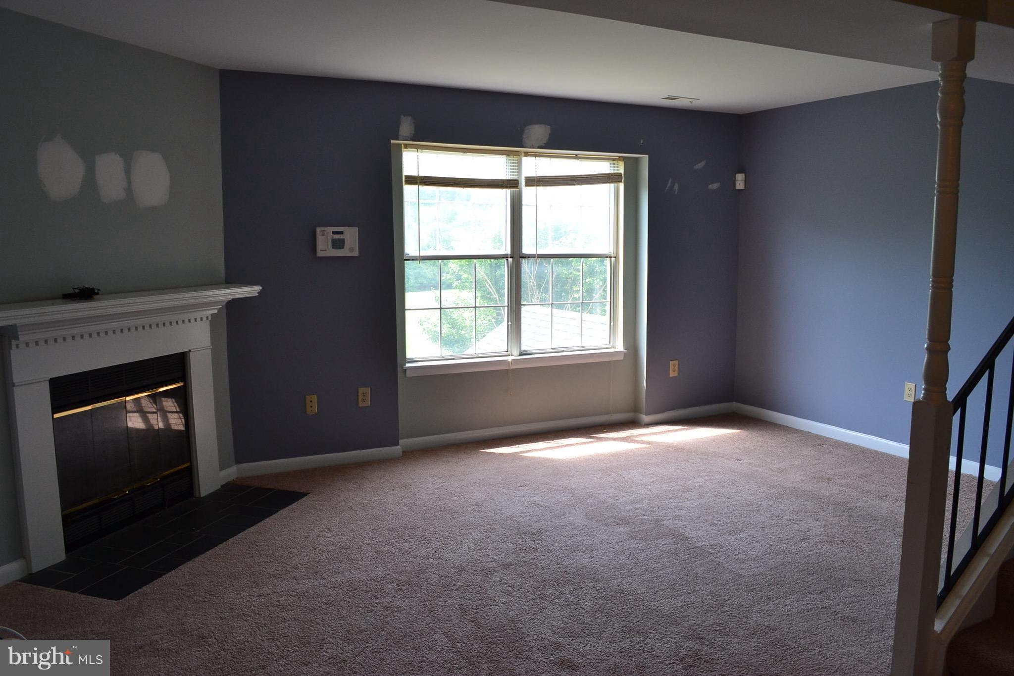 15238 Cloverdale Road Woodbridge, VA 22193 - Photo 11 of 19 a view of empty room with a fireplace