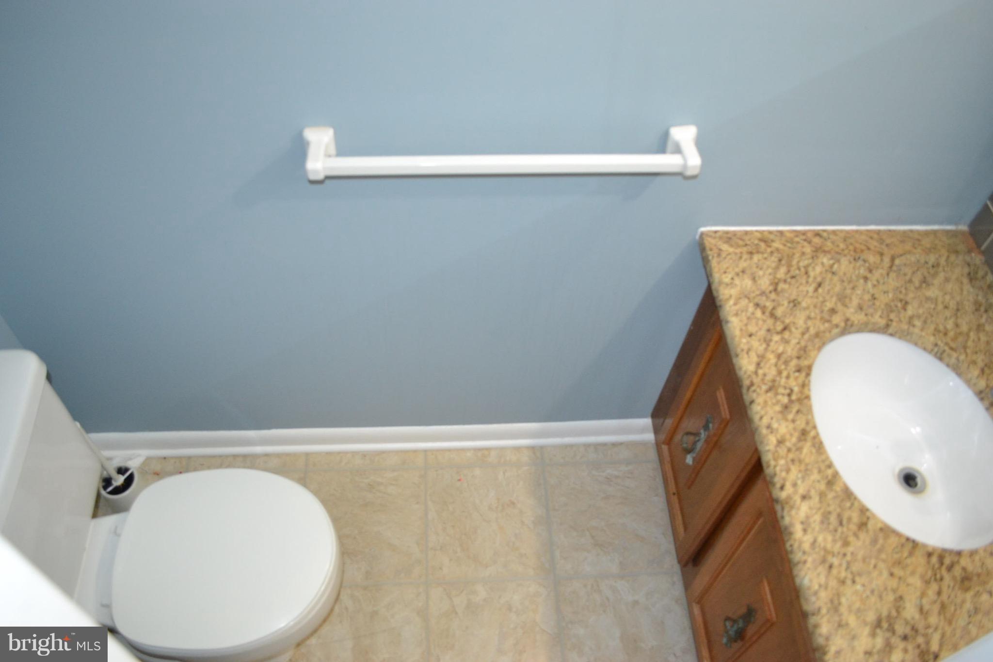 15238 Cloverdale Road Woodbridge, VA 22193 - Photo 4 of 19 a bathroom with a sink and mirror