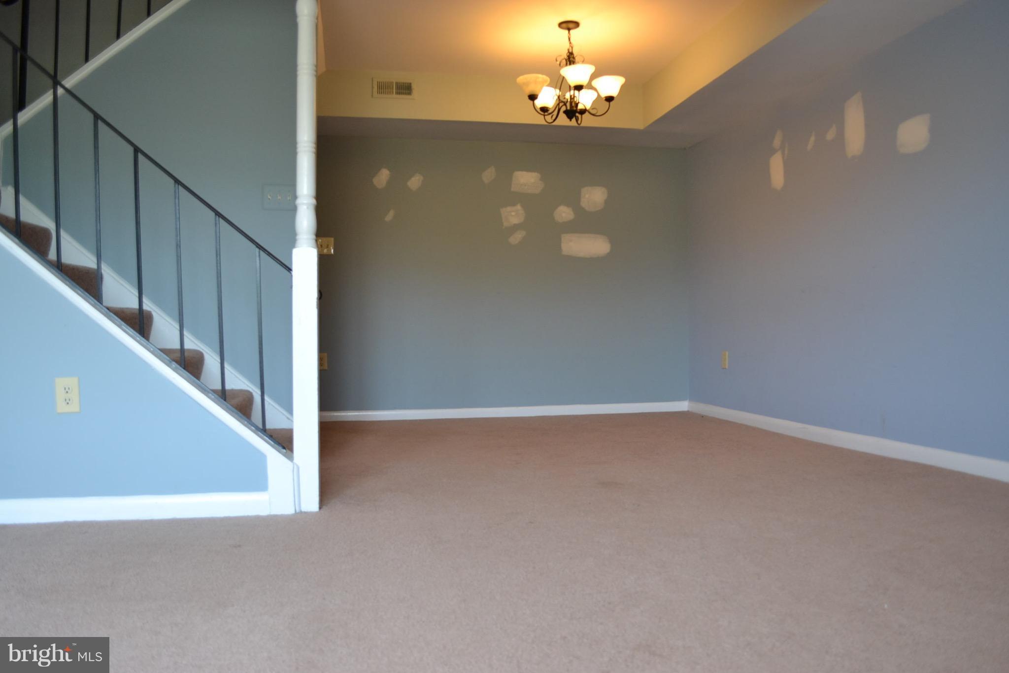 15238 Cloverdale Road Woodbridge, VA 22193 - Photo 5 of 19 a view of a chandelier fan and entryway