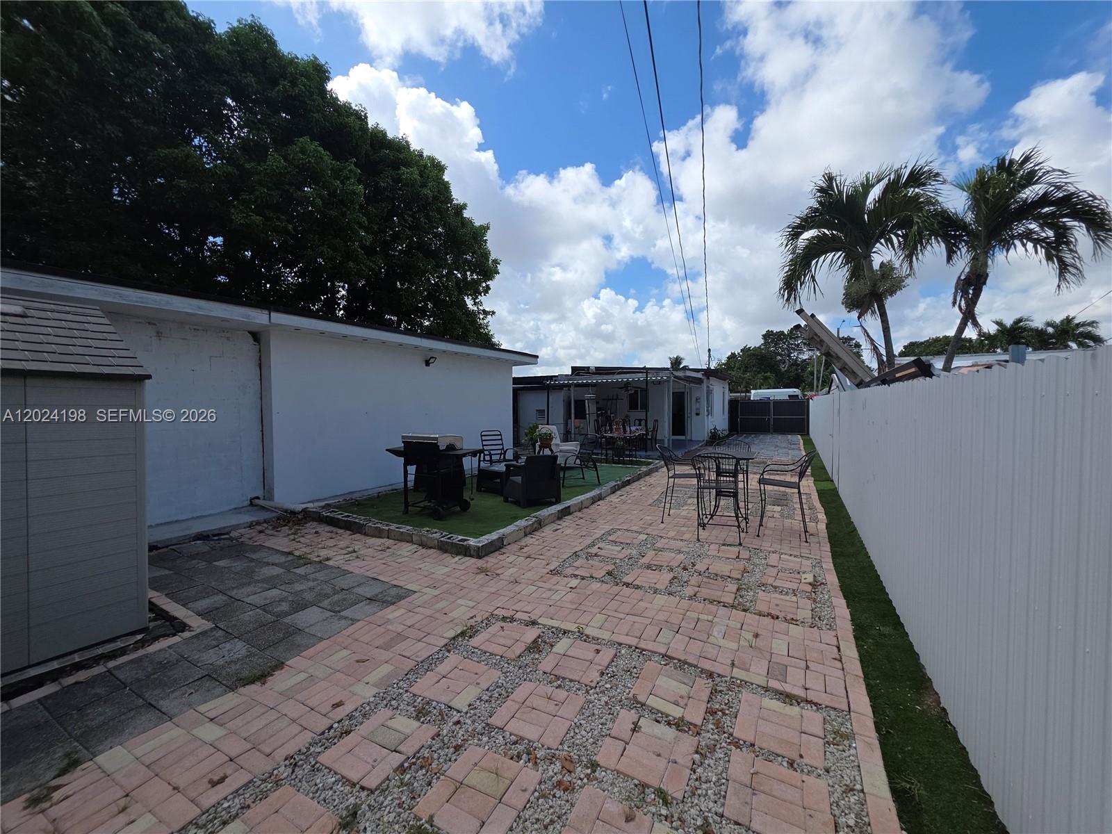 651 East 48th Street Hialeah, FL 33013 - Photo 27 of 52 a view of a backyard with sitting area