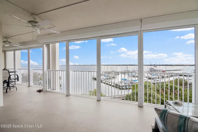 a view of an empty room and a balcony