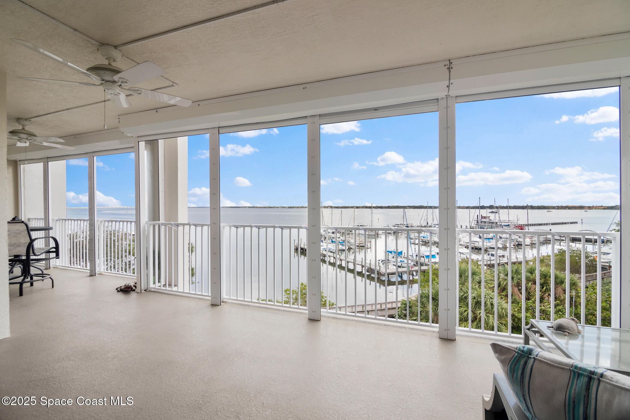a view of an empty room and a balcony