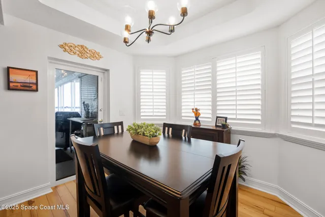 a view of a dining room with furniture and window