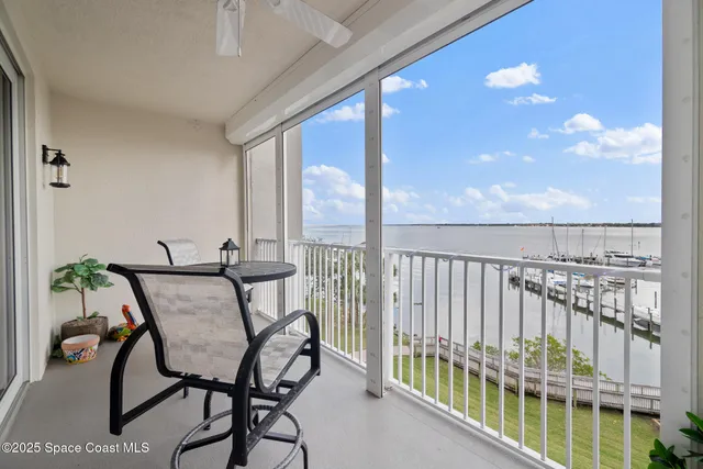 a view of a balcony with furniture