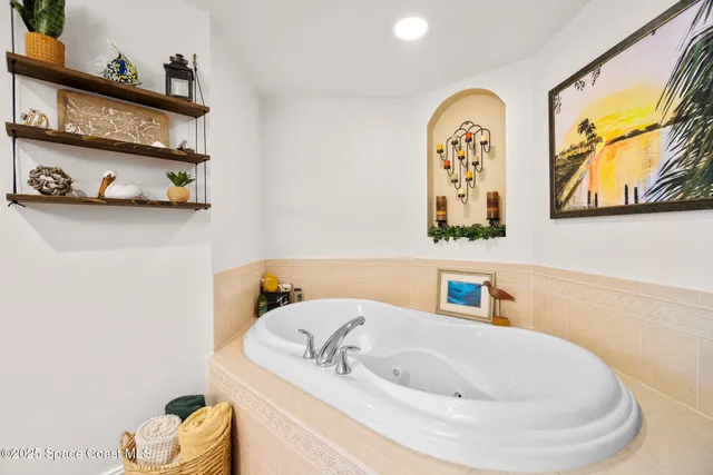 a bathroom with a tub and a sink