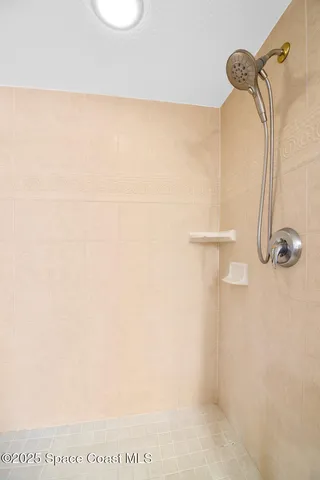 a picture of a bathroom with a shower