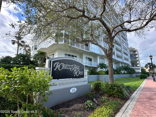 a view of a street with a building in the background