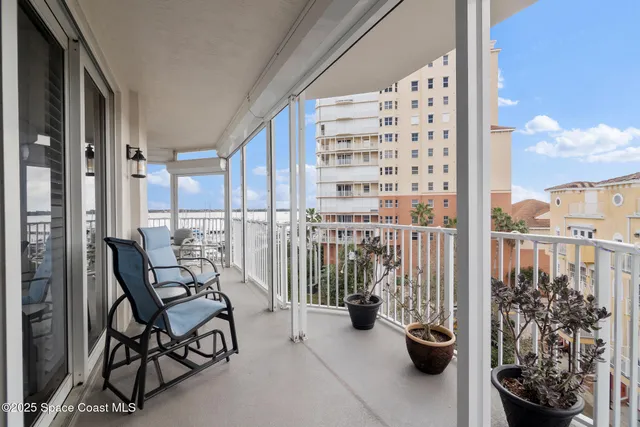 a view of a balcony with wooden floor