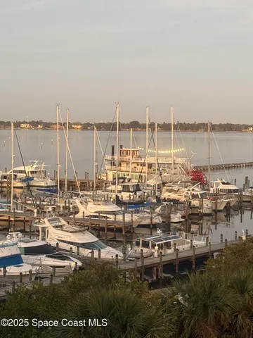 a view of a swimming pool with a table and chairs