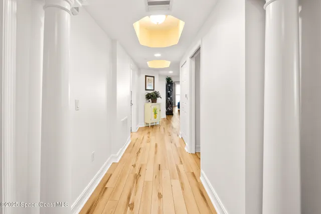 a view of a bedroom from a hallway