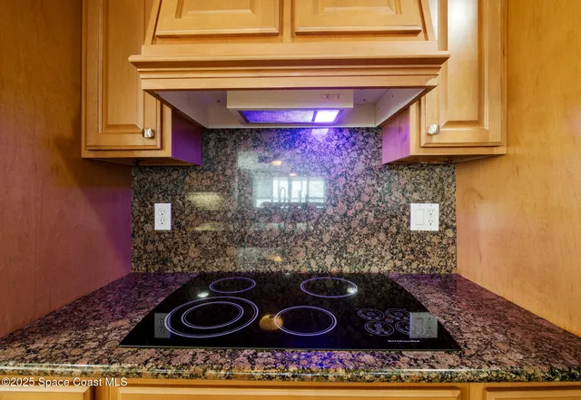 a kitchen with a stove and a microwave