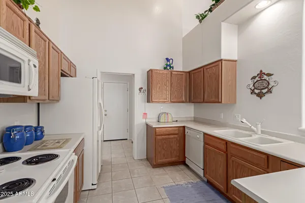 a kitchen with a sink cabinets and appliances