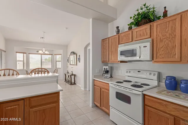 a kitchen with stainless steel appliances a stove a sink and a microwave