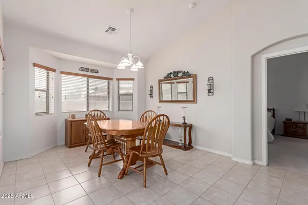 a dining room with furniture and window