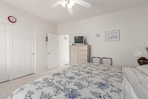 a bedroom with a bed and a dresser