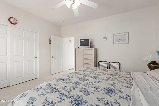 a bedroom with a bed and a dresser