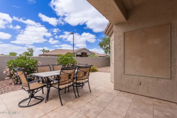 a view of a terrace with furniture and stove