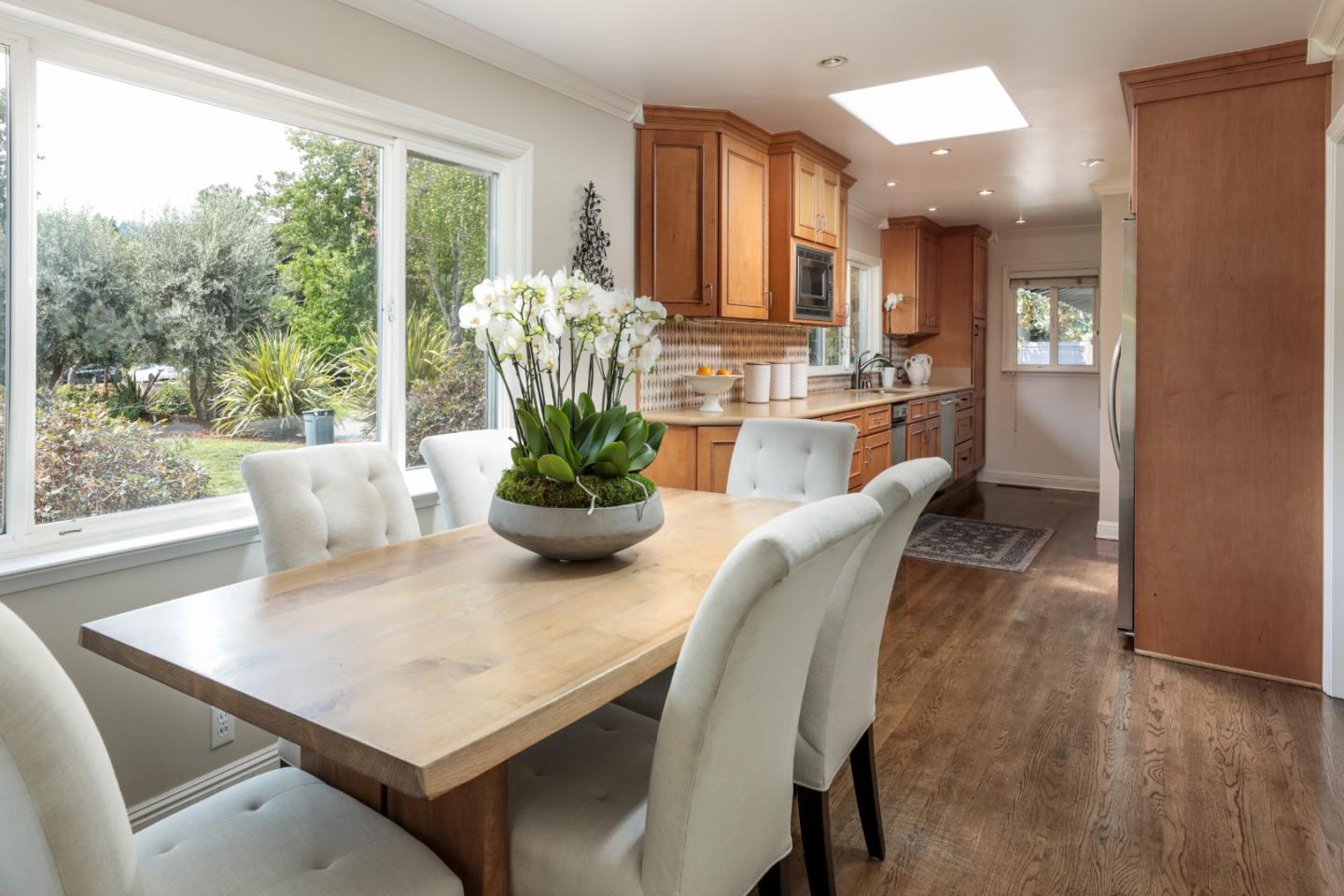 460 Cervantes Road Portola Valley, CA 94028 - Photo 13 of 45 a view of a dining room with furniture and a potted plant