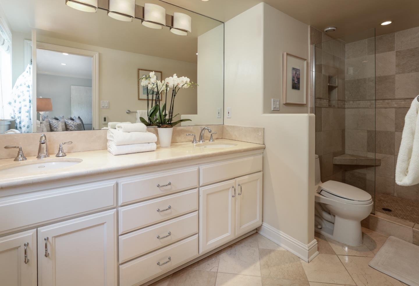 460 Cervantes Road Portola Valley, CA 94028 - Photo 15 of 45 a bathroom with a toilet sink and mirror