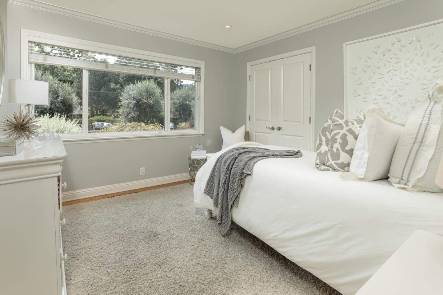 460 Cervantes Road Portola Valley, CA 94028 - Photo 16 of 45 a bedroom with a bed and a large window
