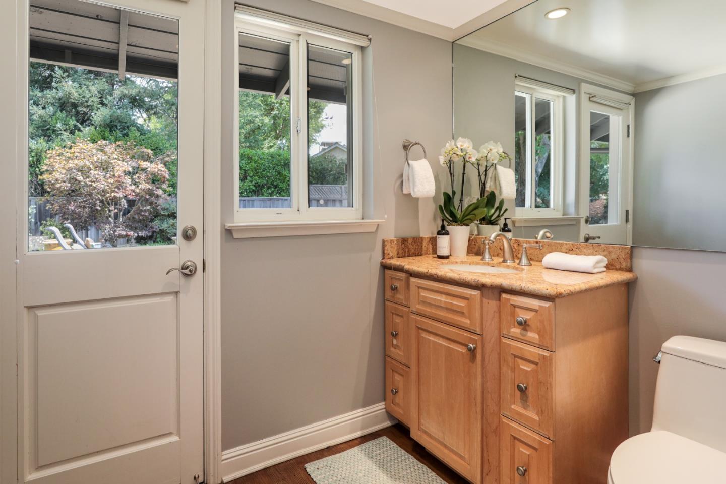 460 Cervantes Road Portola Valley, CA 94028 - Photo 21 of 45 a bathroom with a double vanity sink and a mirror