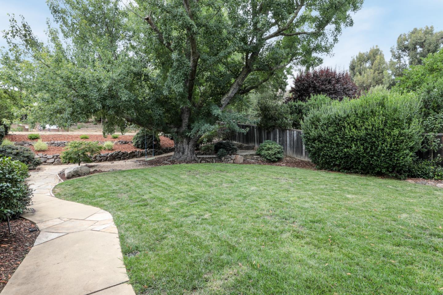 460 Cervantes Road Portola Valley, CA 94028 - Photo 34 of 45 a backyard of a house with lots of green space