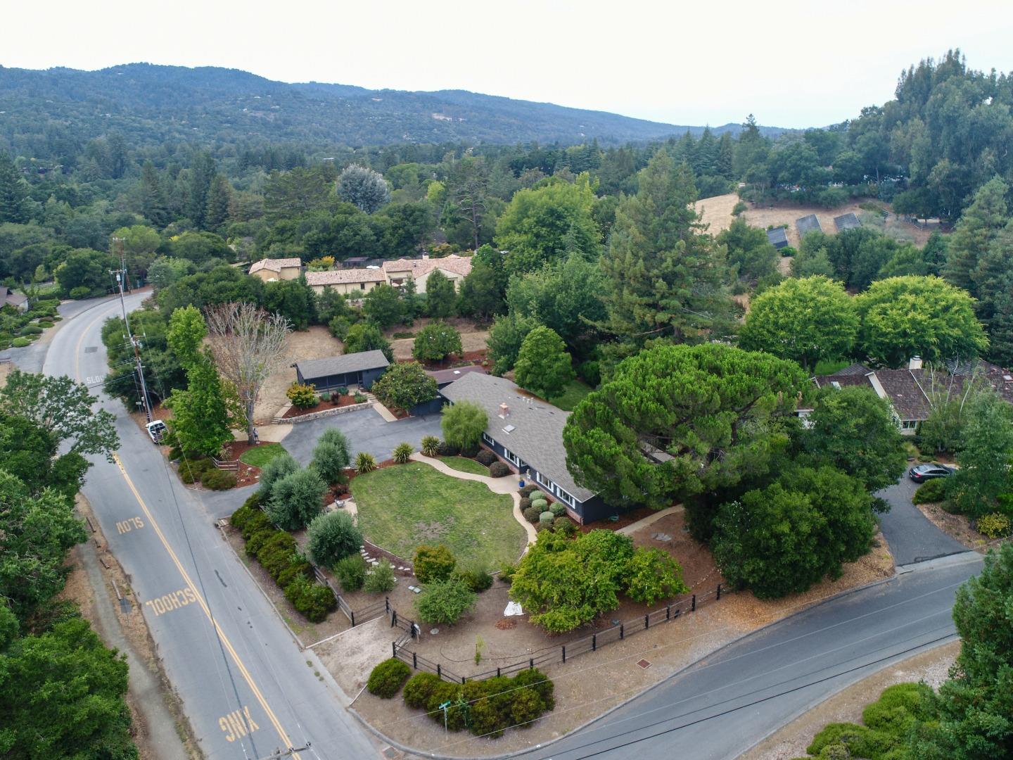460 Cervantes Road Portola Valley, CA 94028 - Photo 45 of 45 an aerial view of green landscape with trees houses and mountain view