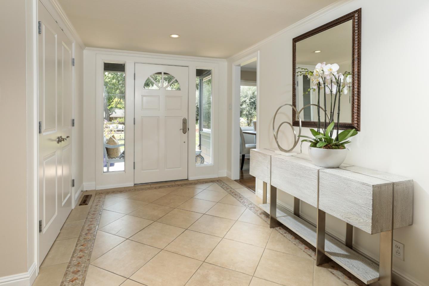 460 Cervantes Road Portola Valley, CA 94028 - Photo 5 of 45 a view of a hallway with wooden floor and windows