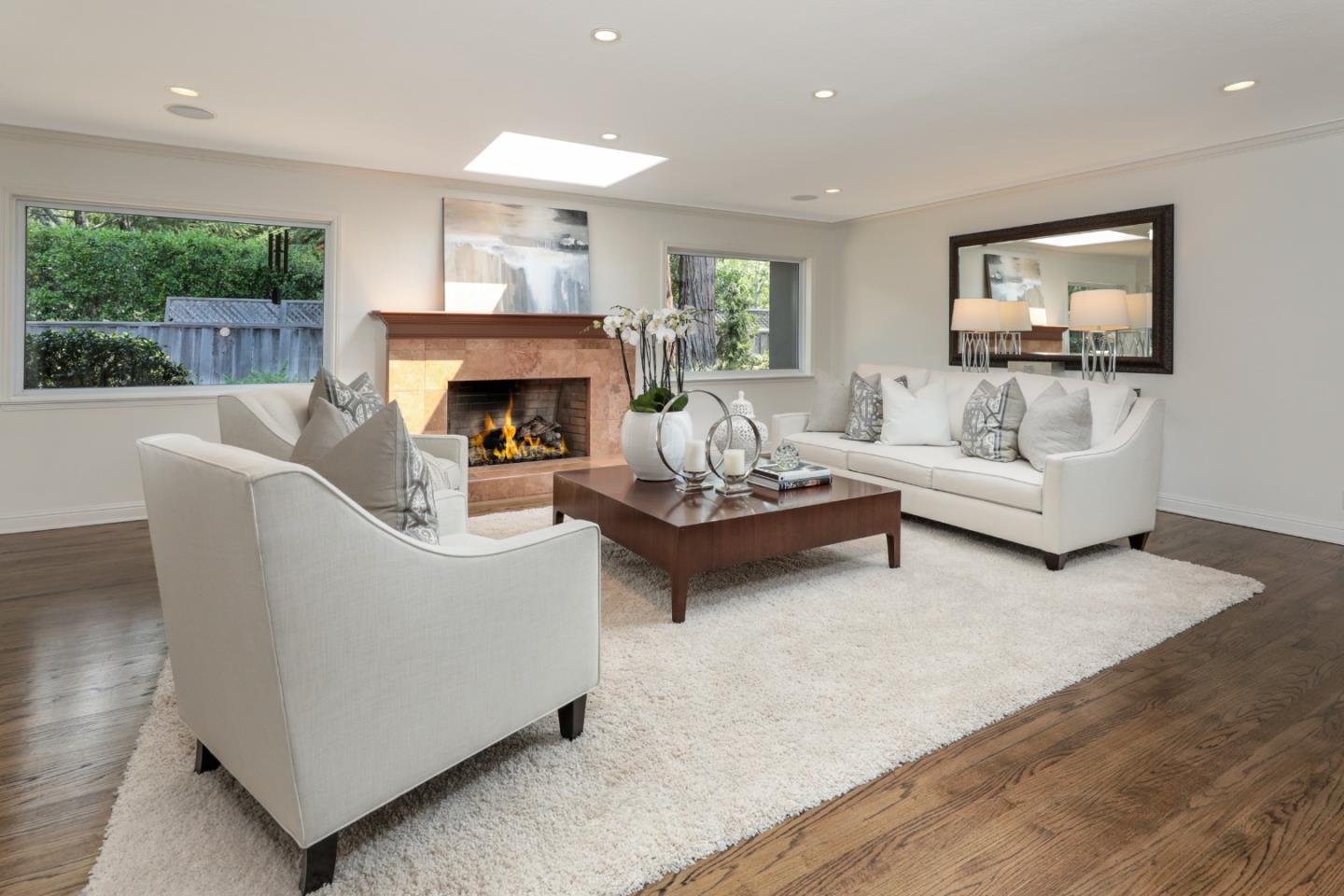 460 Cervantes Road Portola Valley, CA 94028 - Photo 6 of 45 a living room with furniture and a fireplace