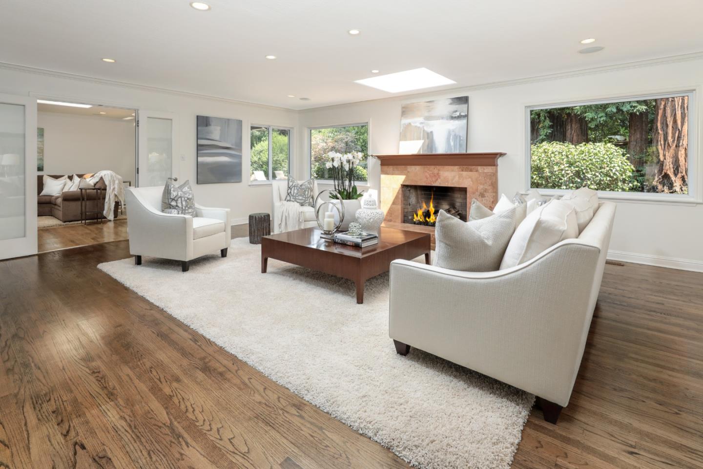 460 Cervantes Road Portola Valley, CA 94028 - Photo 8 of 45 a living room with furniture and a fireplace