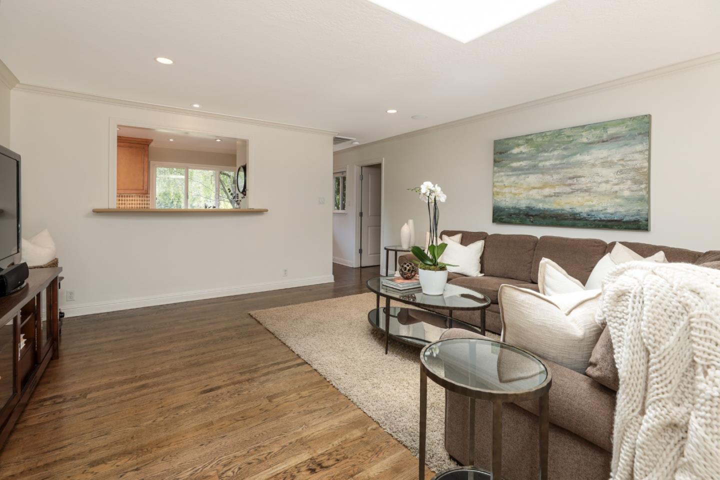 460 Cervantes Road Portola Valley, CA 94028 - Photo 10 of 45 a living room with furniture and a flat screen tv