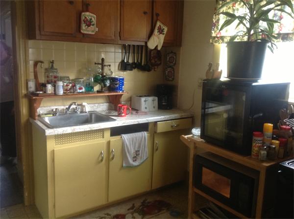 605 State Road Dartmouth, MA 02747 - Photo 3 of 8 a kitchen with a sink and cabinets