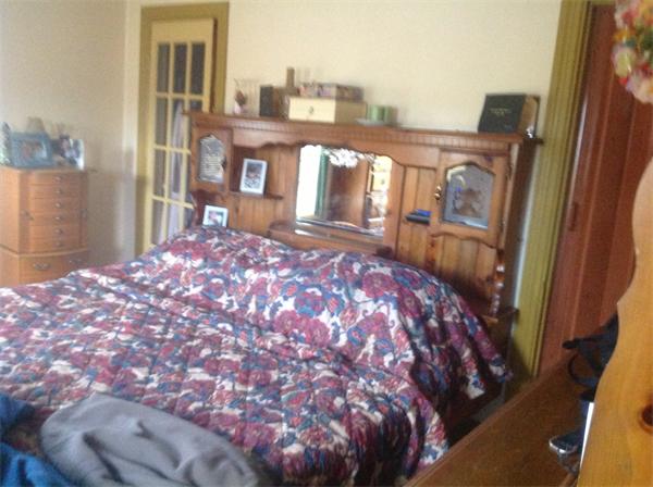 605 State Road Dartmouth, MA 02747 - Photo 6 of 8 a bed sitting in a bedroom next to a window