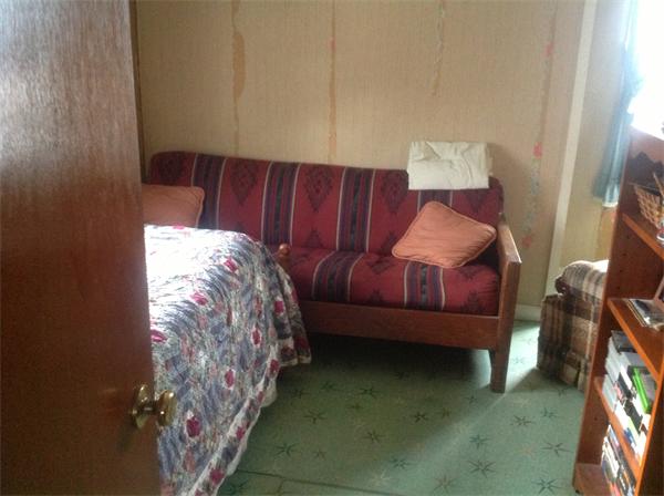 605 State Road Dartmouth, MA 02747 - Photo 7 of 8 a bed sitting in a bedroom next to a window with furniture