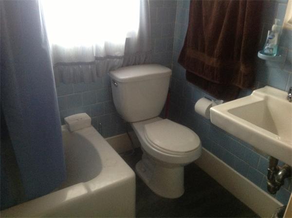 605 State Road Dartmouth, MA 02747 - Photo 8 of 8 a white toilet sitting next to a white sink