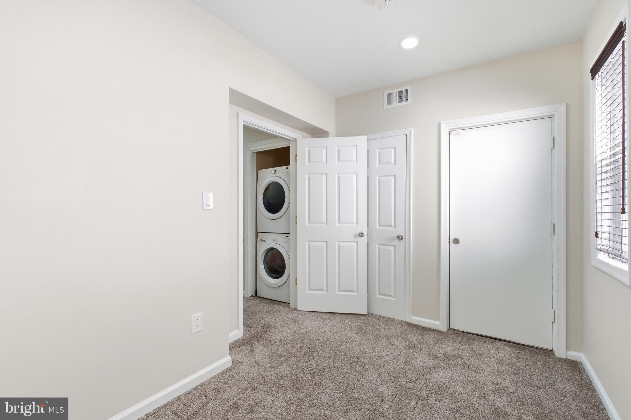 2712 6th Street Northeast Washington, DC 20017 - Photo 20 of 24 a view of a hallway with washer and dryer