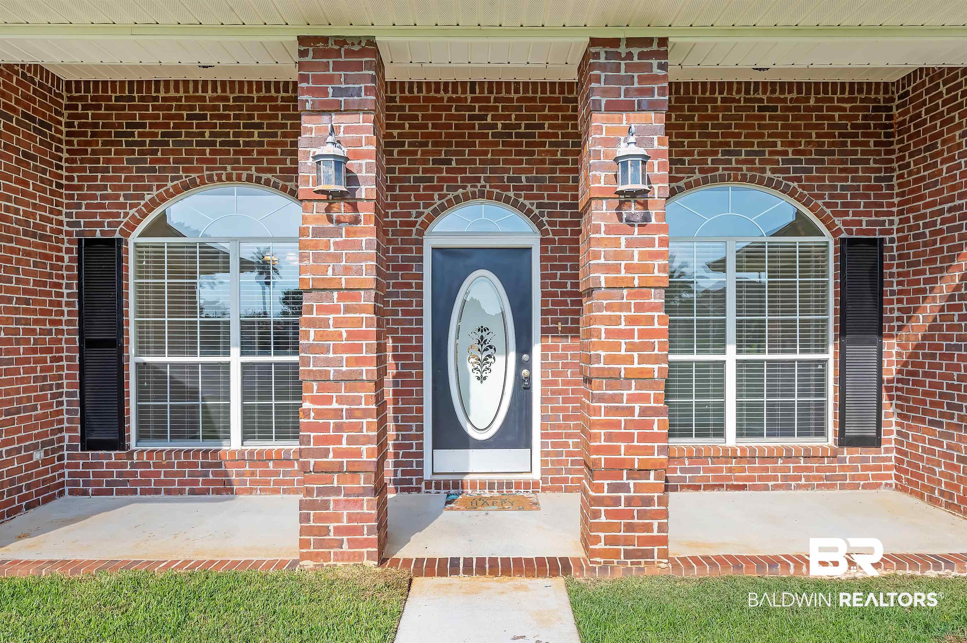12443 Venice Boulevard Foley, AL 36535 - Photo 4 of 59 View of exterior entry with a porch