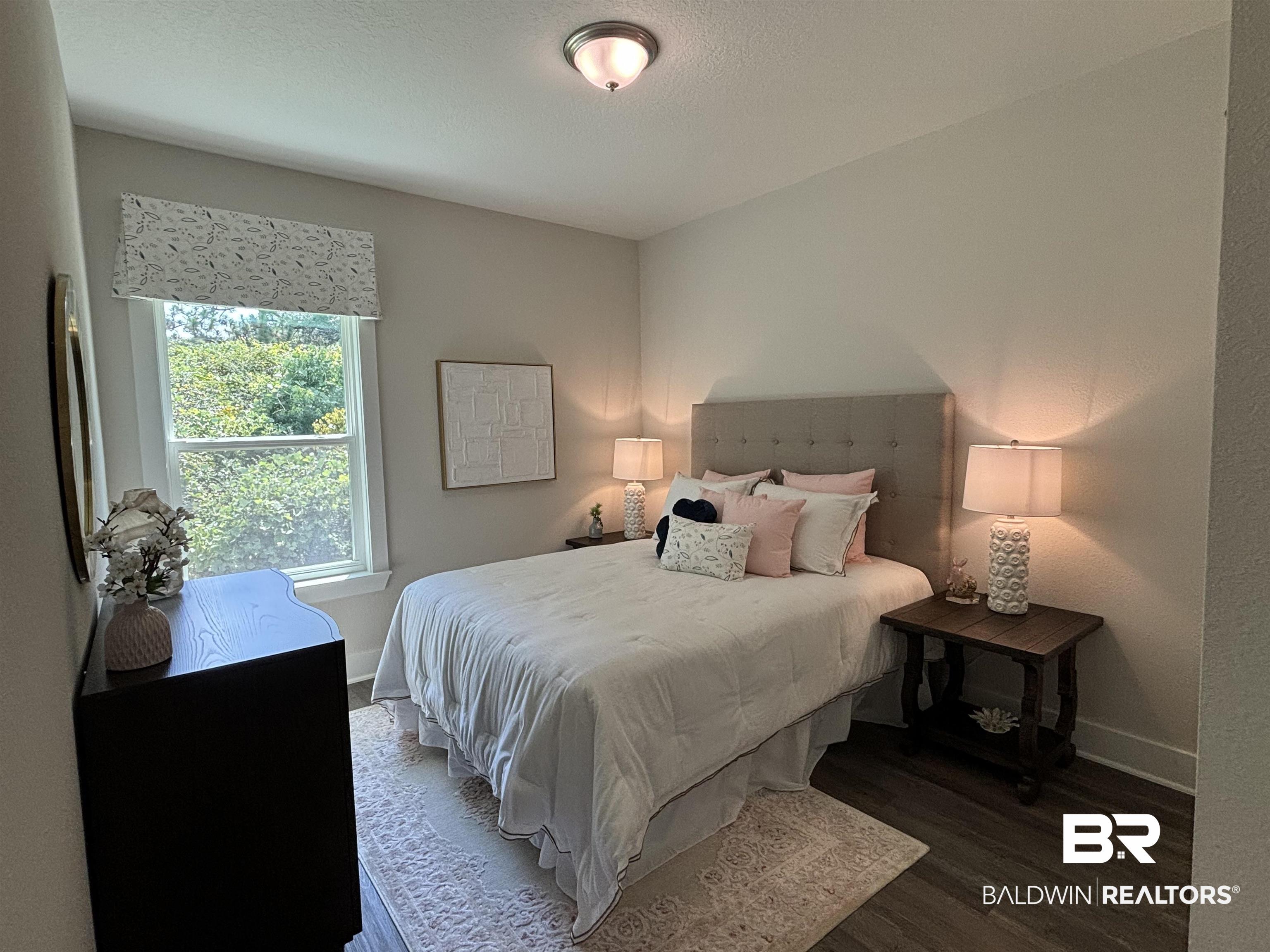 370 Barndling Street Fairhope, AL 36532 - Photo 23 of 30 Bedroom with multiple windows and wood-type flooring