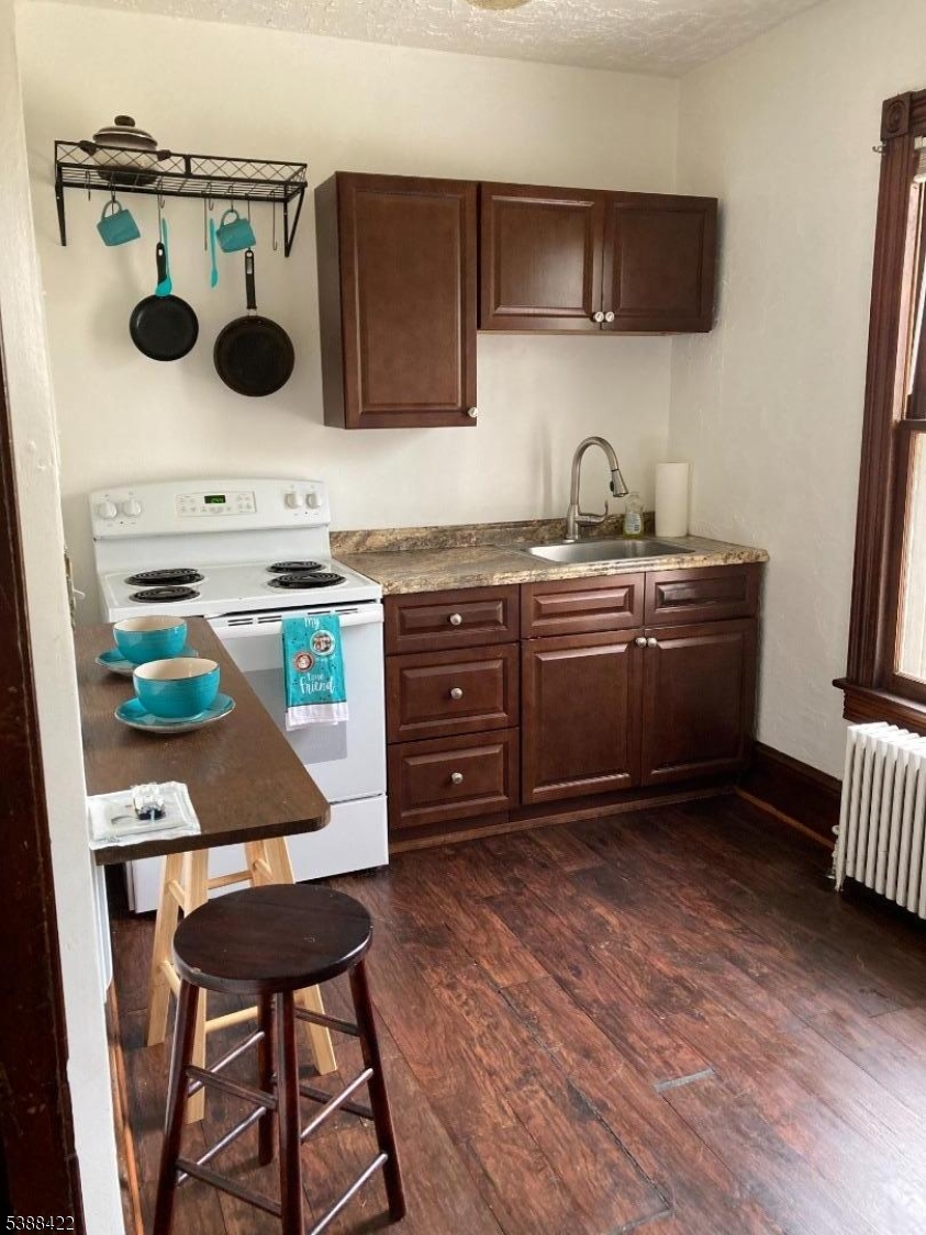 68 Frenchtown Road Milford, NJ 08848 - Photo 5 of 5 a kitchen with a sink a stove and chairs