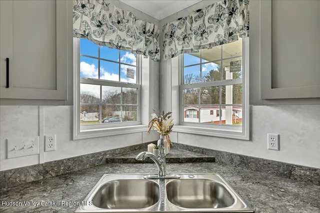 a kitchen with a sink and a window