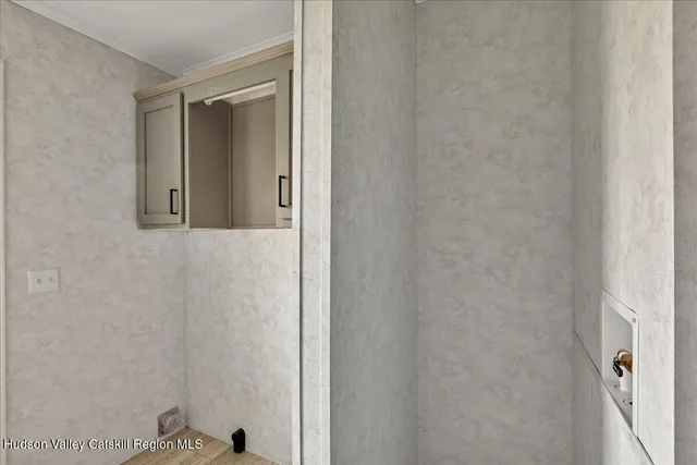 a bathroom with a shower and a sink