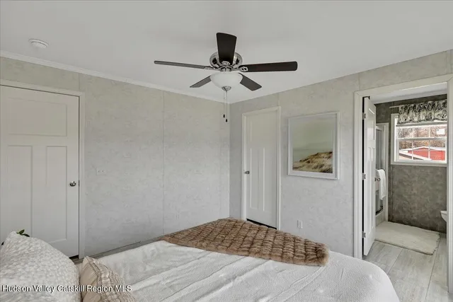 a bedroom with a bed and a walk in closet