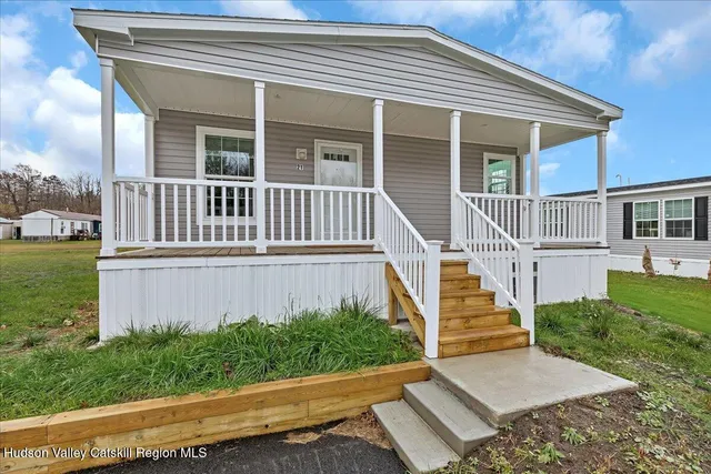 front view of a house with a yard