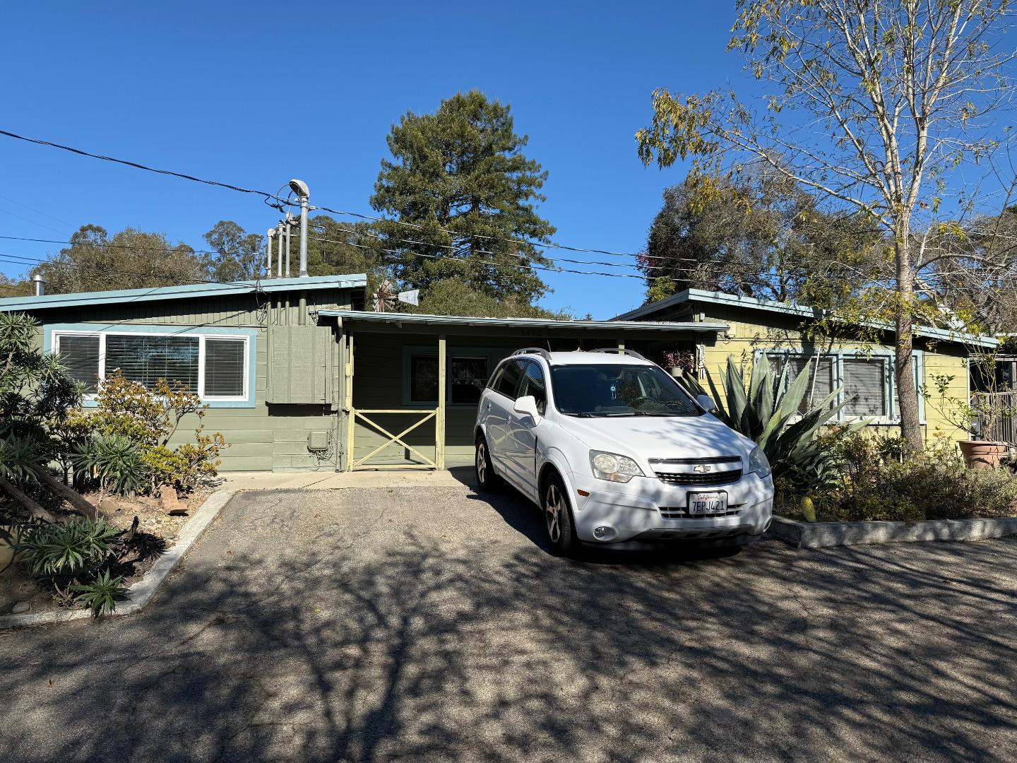 3460 Maplethorpe Lane Soquel, CA 95073 - Photo 4 of 15 a white house covered with tall trees
