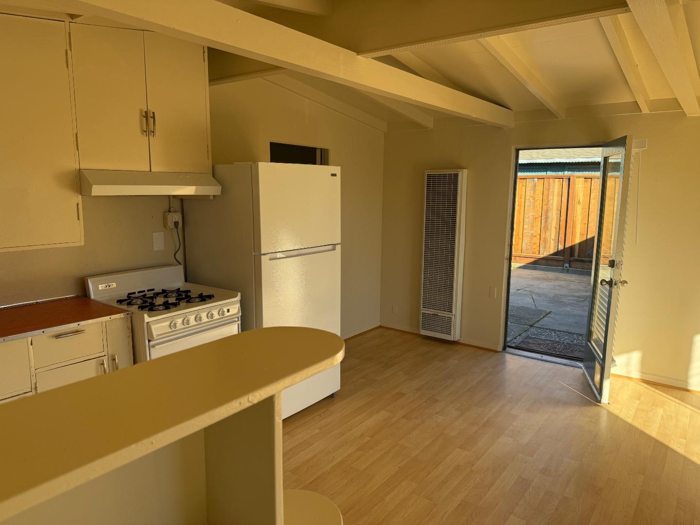 3460 Maplethorpe Lane Soquel, CA 95073 - Photo 10 of 15 a kitchen with a refrigerator a stove top oven a sink and dishwasher