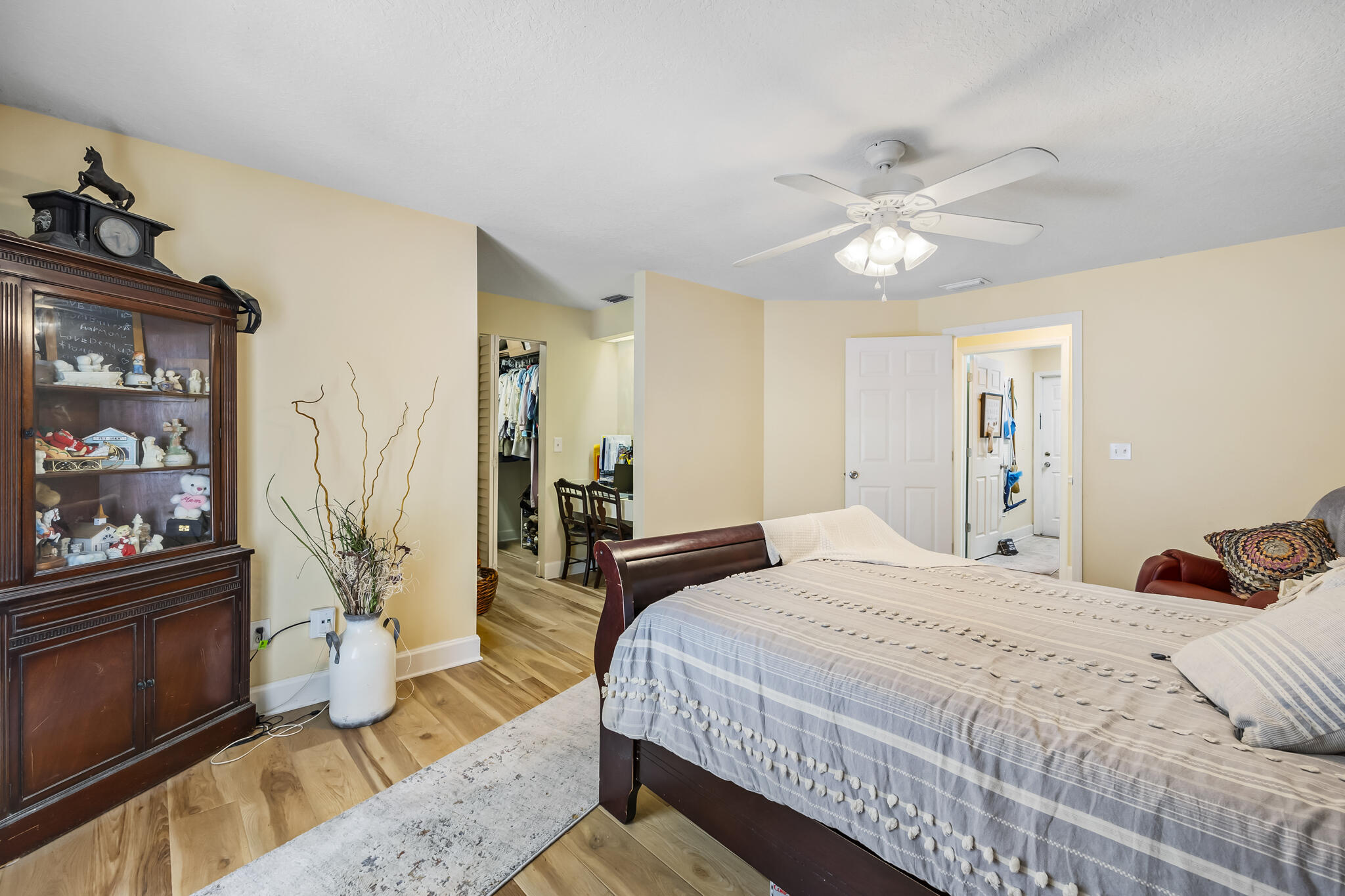 4650 Lake Washington Road Melbourne, FL 32934 - Photo 16 of 46 a bedroom with a bed and dresser with mirror