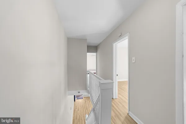 a view of a room with a wooden floor