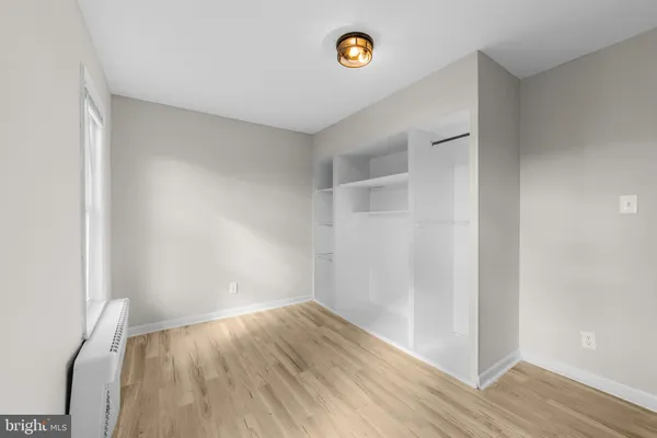 a view of room with wooden floor